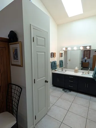 a living room with a couch and a sink