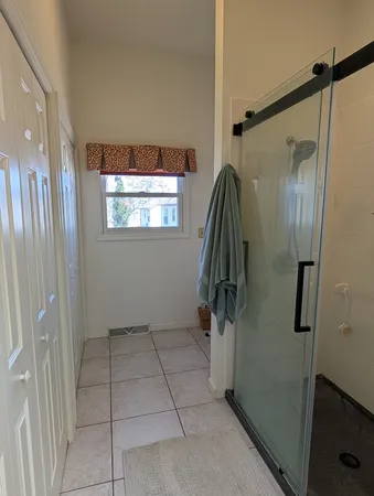 a bathroom with a shower and toilet