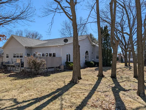 a view of a house with snow on the road