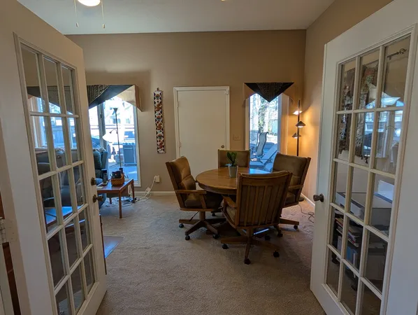 a view of a livingroom with furniture and a window