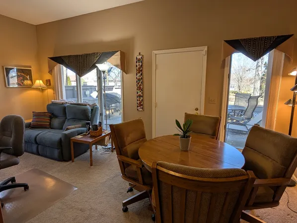 a living room with furniture and a table