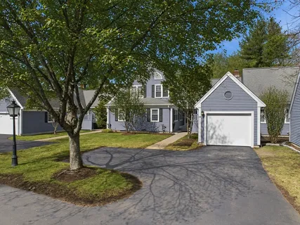 a kitchen with granite countertop kitchen island stainless steel appliances a refrigerator and microwave