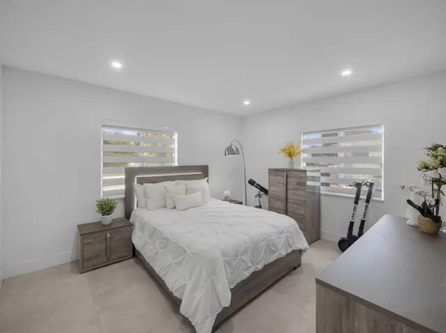 a bedroom with a bed and a table