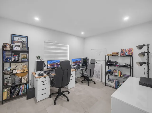 a view of a workspace with furniture