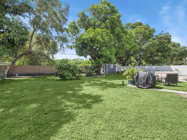 a view of a backyard with sitting area