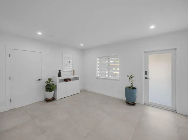 a view of a living room and workspace