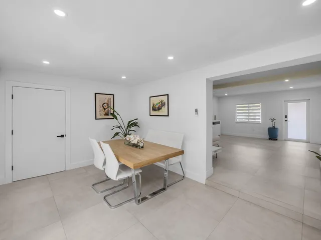 a view of a livingroom with furniture and a table
