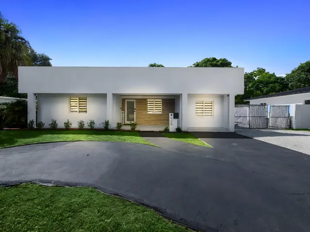 a view of road with front of house