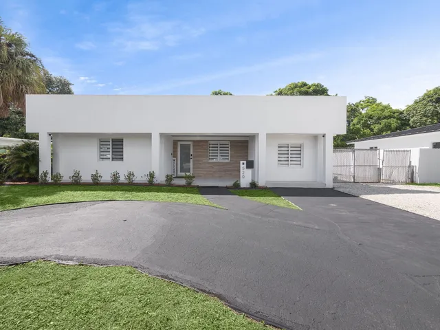 a view of a house with a street