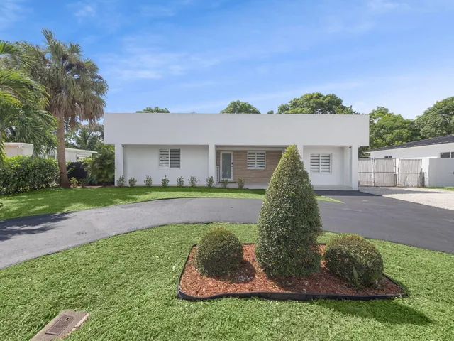 front view of a house with a yard