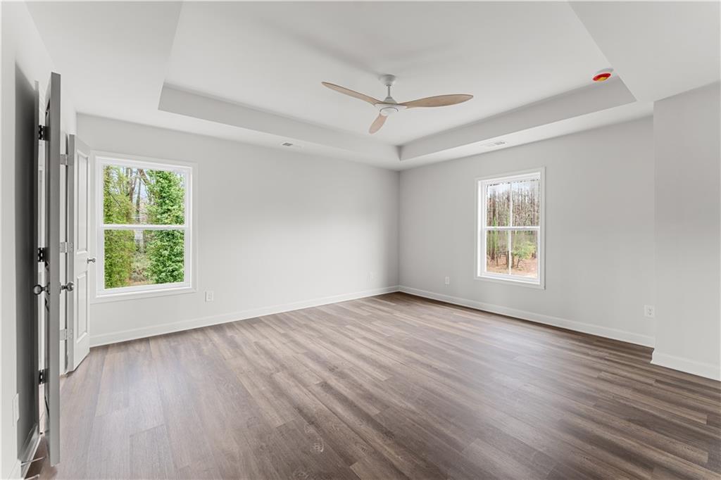 3810 Cottage Circle Clarkston, GA 30021 - Photo 8 of 11 a view of an empty room with wooden floor and a window