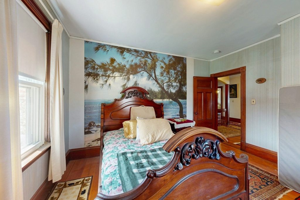 264 Court Road Winthrop, MA 02152 - Photo 13 of 26 a bedroom with a bed and a painting on the wall