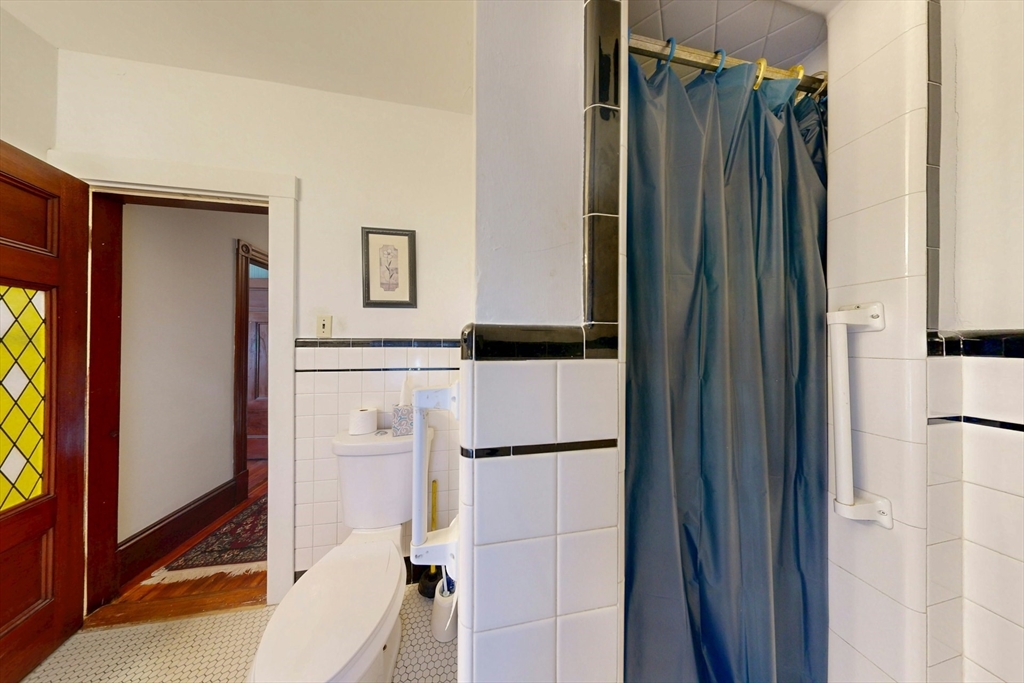 264 Court Road Winthrop, MA 02152 - Photo 16 of 26 a bathroom with a shower and a mirror