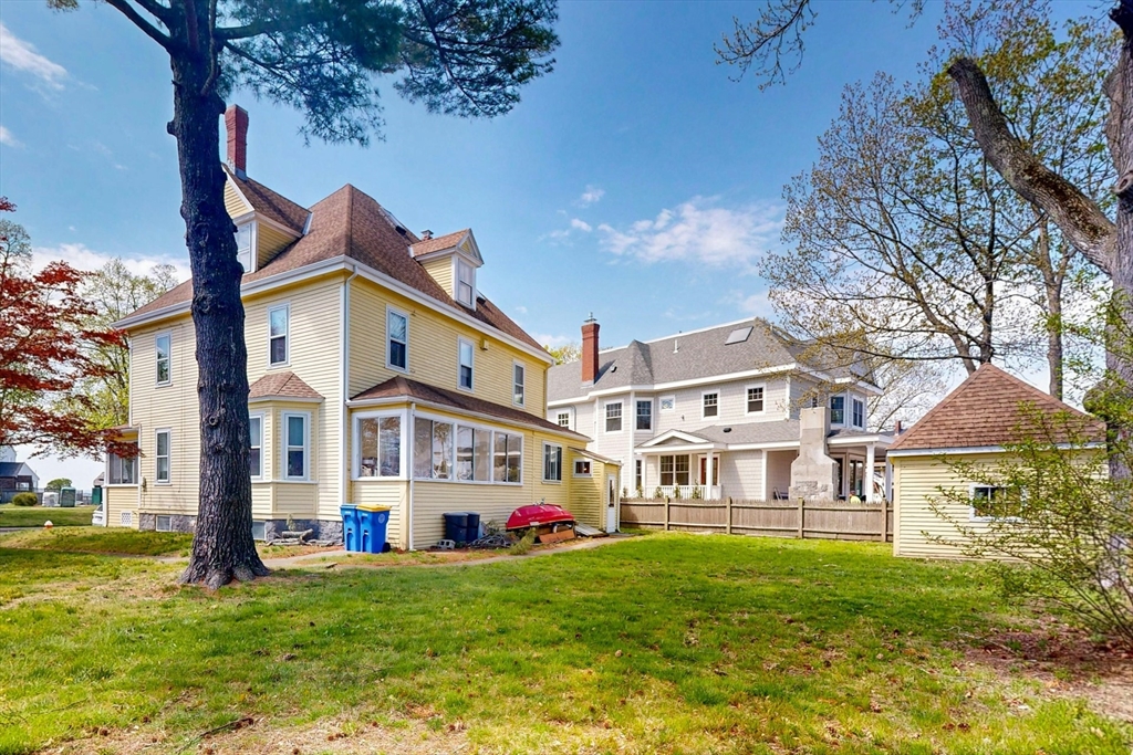 264 Court Road Winthrop, MA 02152 - Photo 24 of 26 a front view of a building with a garden and trees