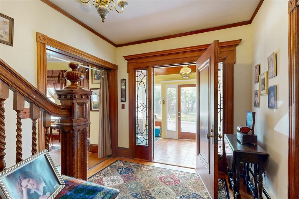 264 Court Road Winthrop, MA 02152 - Photo 3 of 26 a view of a hallway with wooden floor and windows