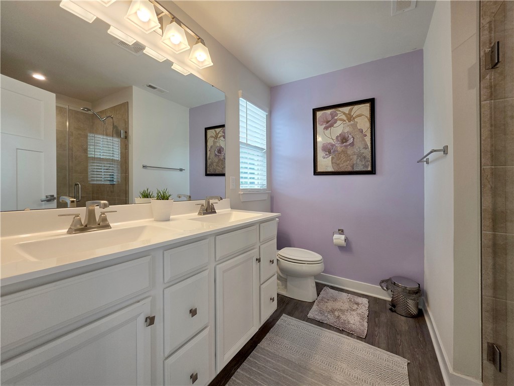 224 Bronson Ridge Anderson, SC 29621 - Photo 17 of 42 Double vanity and modern fixtures create a refreshing and functional bathroom space.