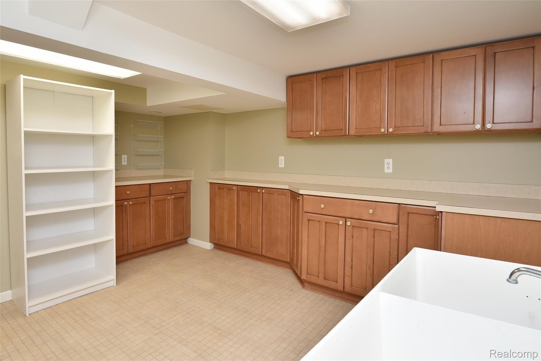 840 Rivenoak Street Birmingham, MI 48009 - Photo 30 of 34 Oversized Laundry Room ~ Folding Area ~ Gift Wrapping Space ~ Countertops + Cabinets