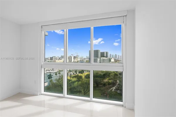 a view of a room with a large window