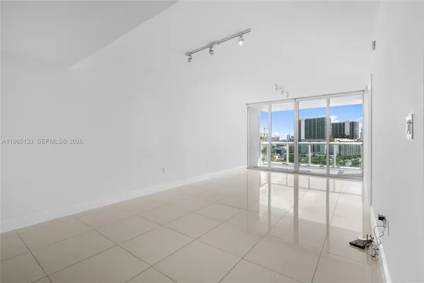 a view of a room with cabinet wooden floor and window