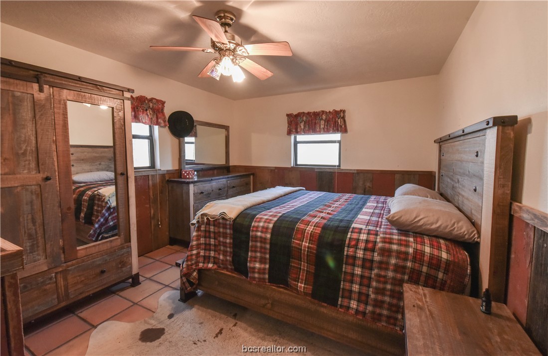 12200 Winn Road Kosse, TX 76653 - Photo 11 of 34 a bedroom with a bed dresser and a window