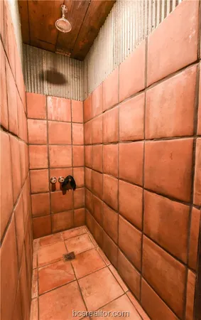 a bathroom with a toilet mirror and vanity