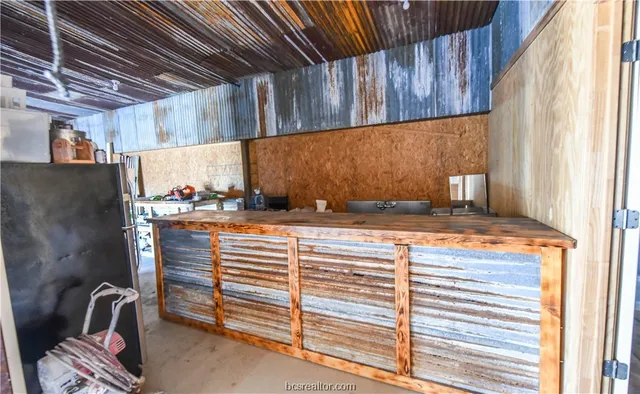 a view of wooden house with a yard