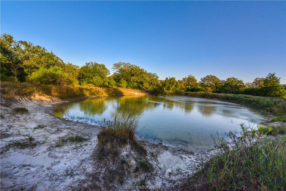 12200 Winn Road Kosse, TX 76653 - Photo 21 of 34 a view of a lake from a yard
