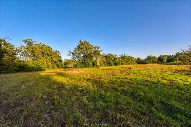 a view of a lake view with a big yard