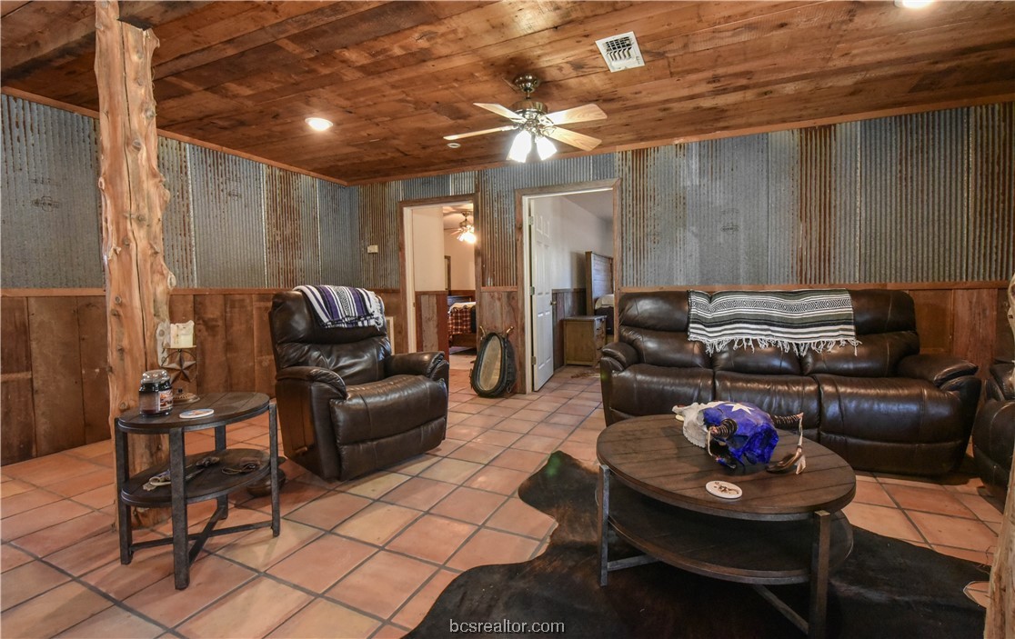 12200 Winn Road Kosse, TX 76653 - Photo 5 of 34 a living room with furniture and a chandelier