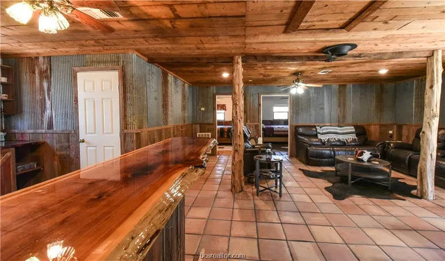 a kitchen with stainless steel appliances granite countertop a stove a sink and a cabinets