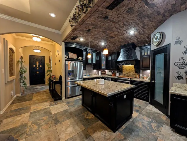 a kitchen with stainless steel appliances granite countertop a sink counter space and stainless steel appliances