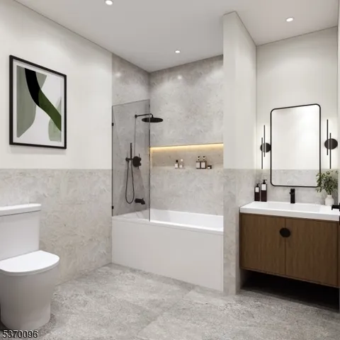 a bathroom with a toilet a sink and bathtub