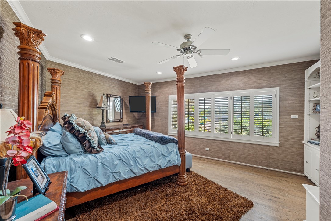 7110 Fish Pond Road Waco, TX 76710 - Photo 14 of 44 a bedroom with a bed dresser and a window