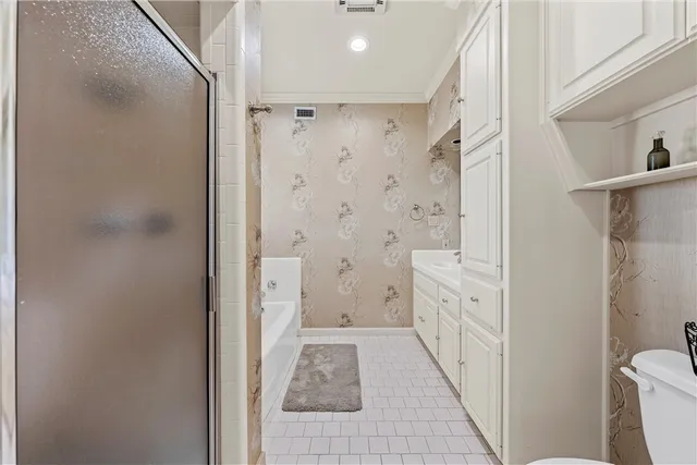 a bathroom with a shower and a toilet