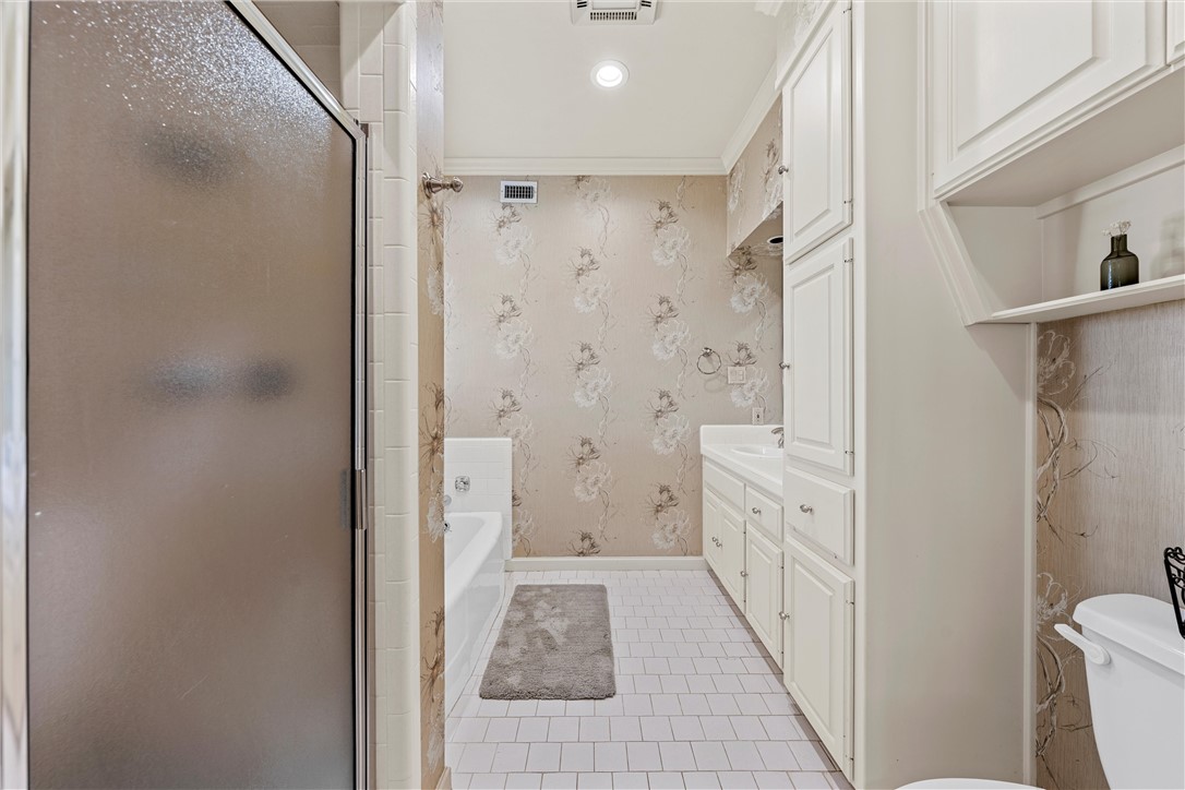 7110 Fish Pond Road Waco, TX 76710 - Photo 15 of 44 a bathroom with a shower and a toilet