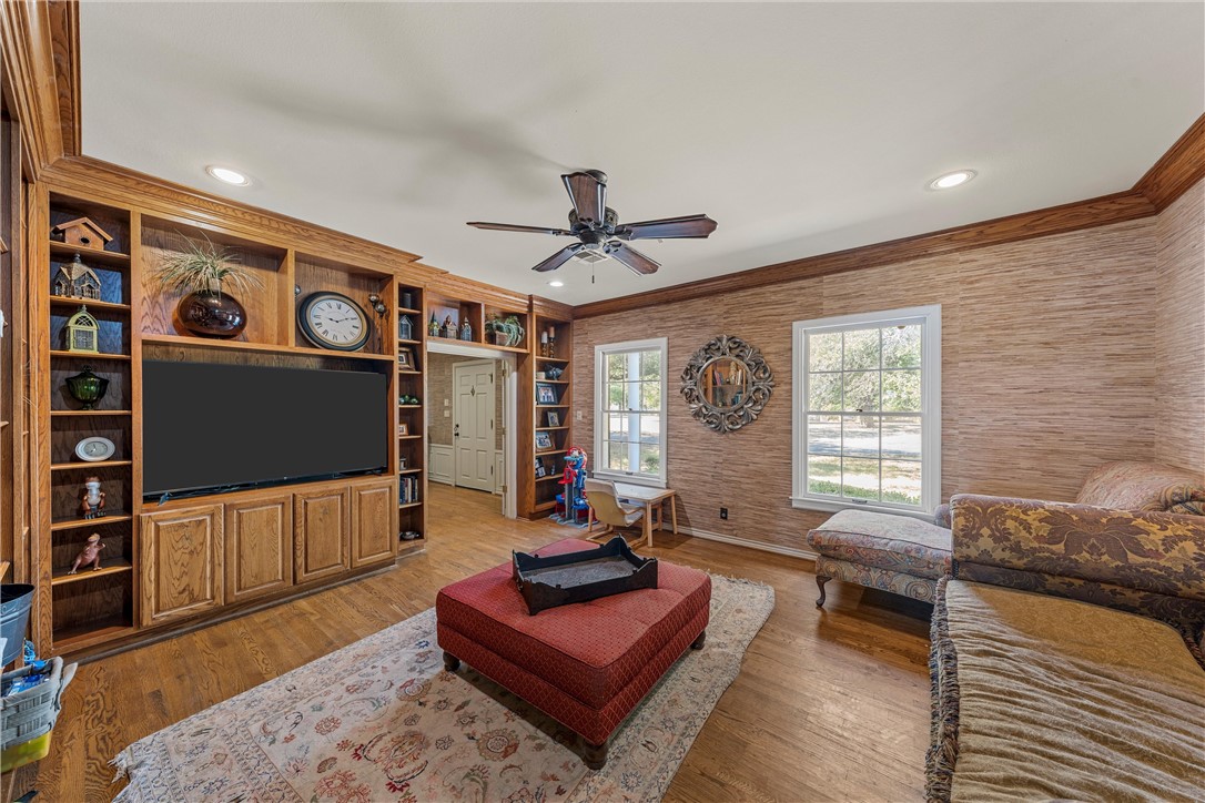 7110 Fish Pond Road Waco, TX 76710 - Photo 19 of 44 a living room with furniture and a flat screen tv