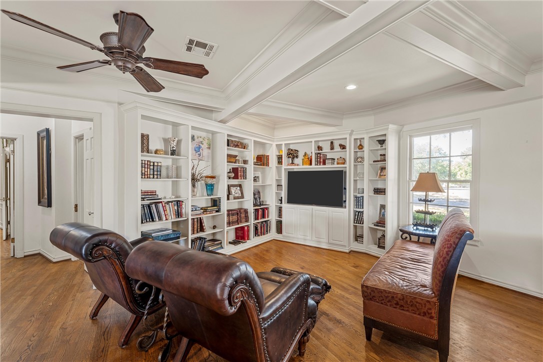 7110 Fish Pond Road Waco, TX 76710 - Photo 21 of 44 a living room with furniture a flat screen tv and a table