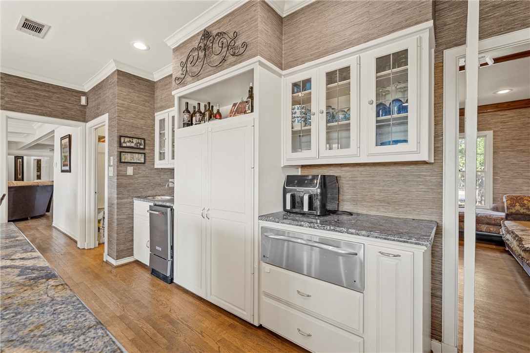 7110 Fish Pond Road Waco, TX 76710 - Photo 29 of 44 a kitchen with stainless steel appliances granite countertop a refrigerator and a stove top oven
