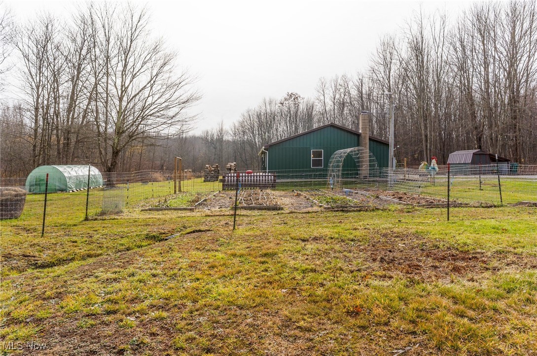 6590 Hall Road Andover, OH 44003 - Photo 25 of 29 View of yard with a garden and greenhouse