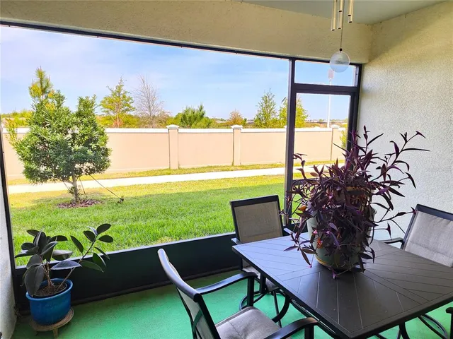 a view of a dining room with furniture window and outside view