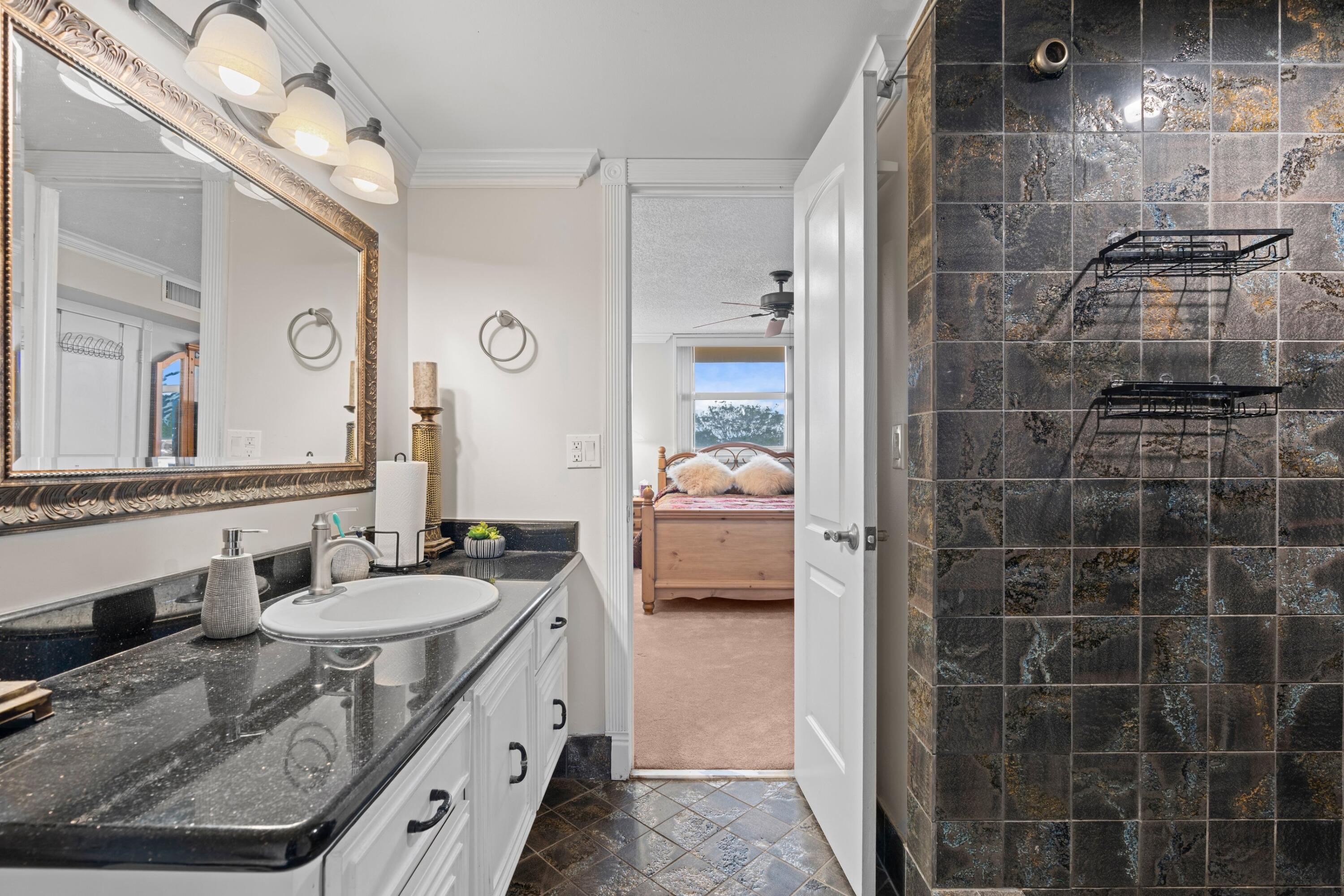 6461 Northwest 2nd Avenue, Unit 415 Boca Raton, FL 33487 - Photo 14 of 25 Guest Bathroom