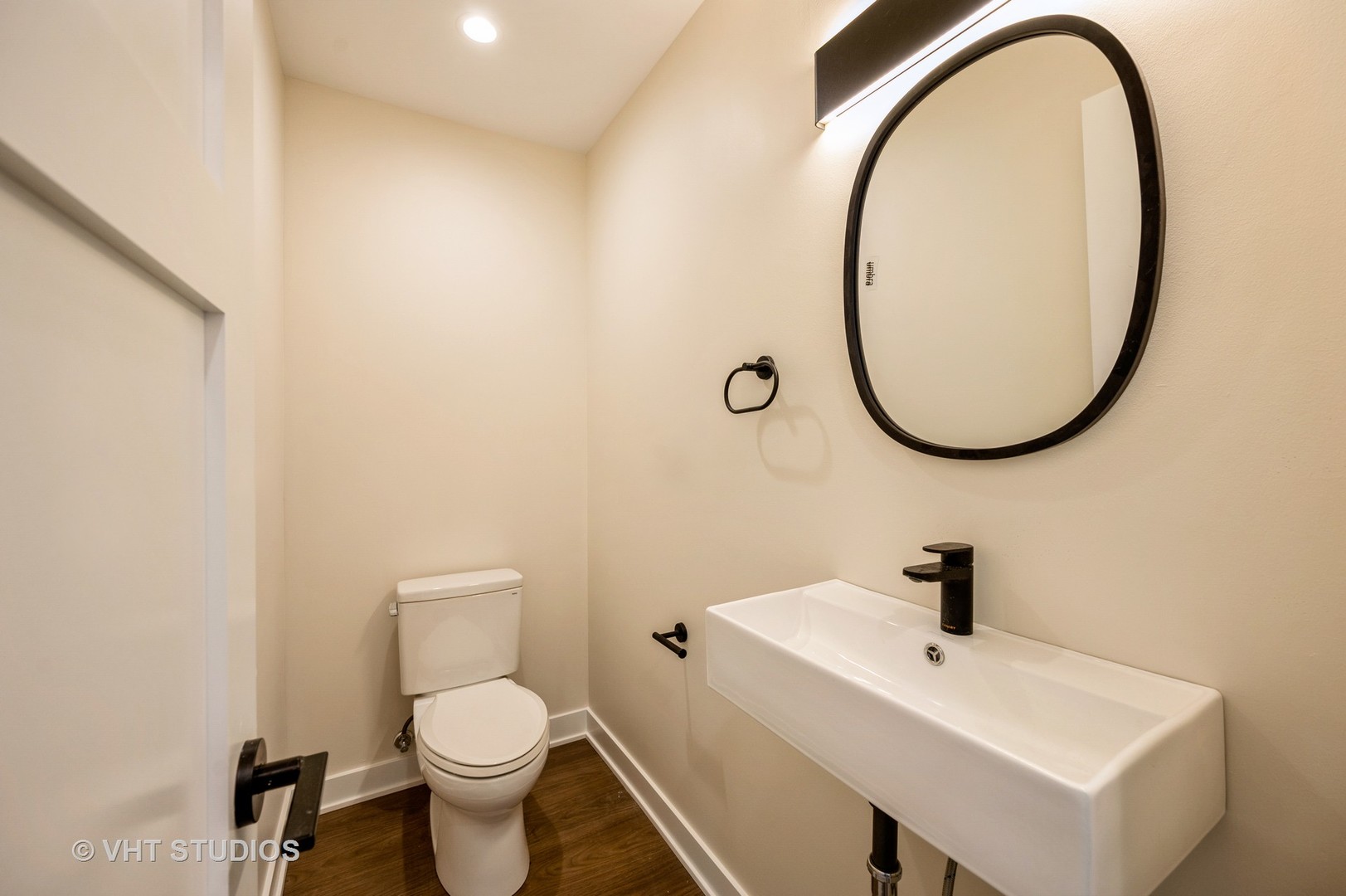 47 Birchwood Road Northbrook, IL 60062 - Photo 7 of 10 a bathroom with a toilet sink and mirror