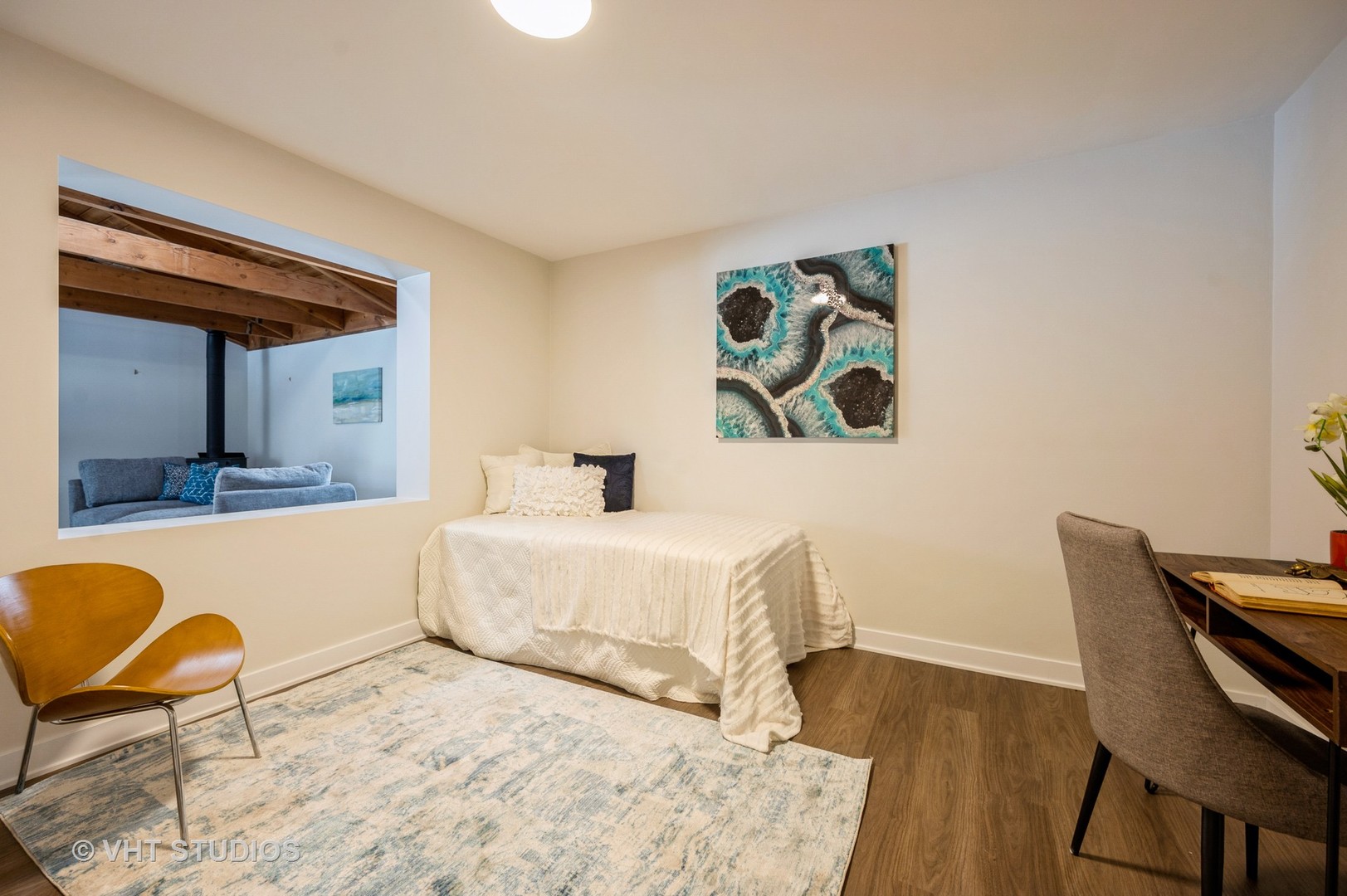 47 Birchwood Road Northbrook, IL 60062 - Photo 9 of 10 a bedroom with a bed and a chair with the wooden floor
