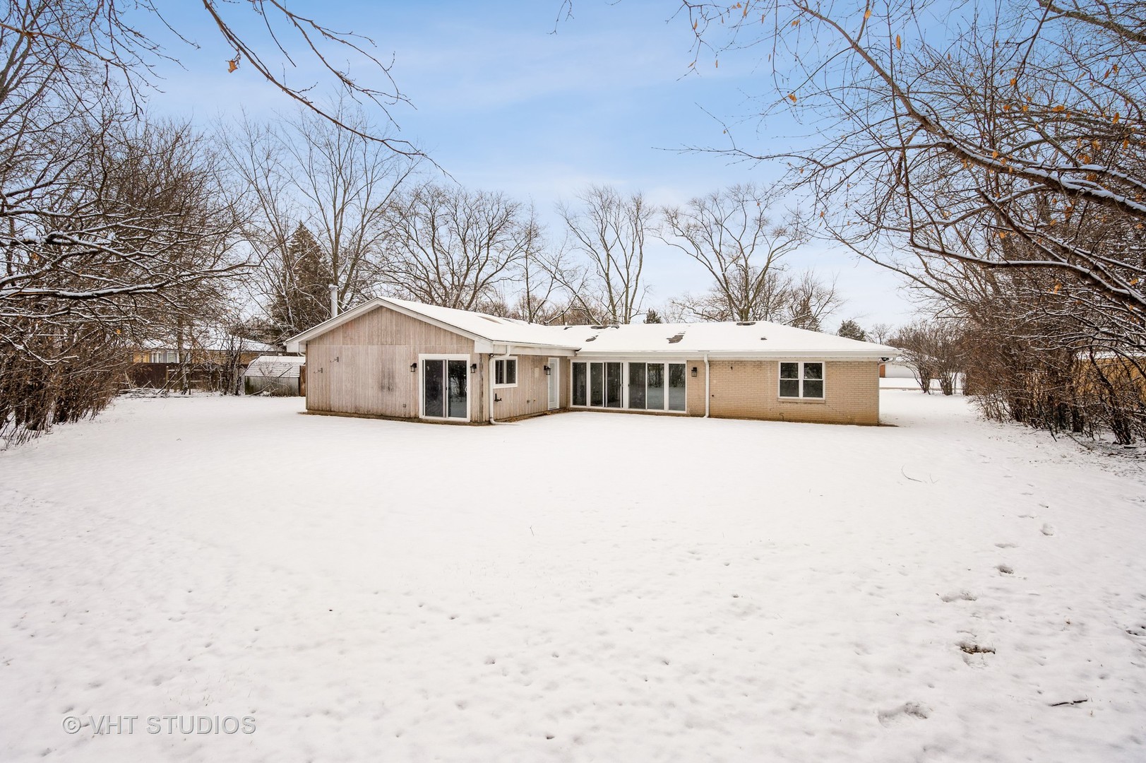47 Birchwood Road Northbrook, IL 60062 - Photo 10 of 10 a white house with a large tree in front of it