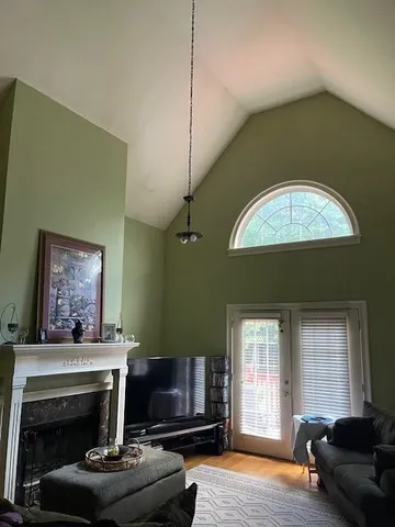 a living room with furniture and a fireplace