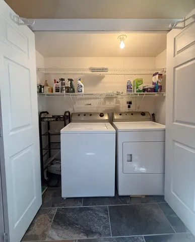 a view of a big room with closet and a ceiling fan