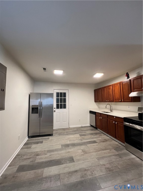 1403 Algona Road Chesapeake, VA 23324 - Photo 11 of 39 Kitchen featuring wood-finish flooring, stainless