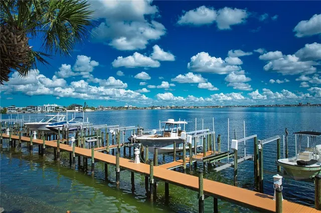 a view of a lake with a house in the background