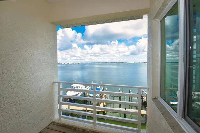 a bathroom with a granite countertop sink and a large mirror