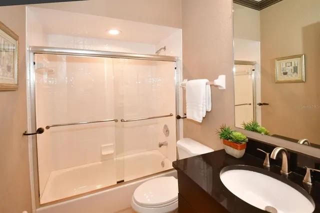 a front view of a building with a yard table and chairs